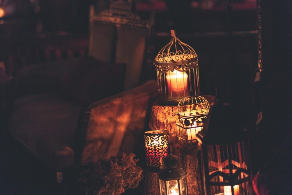 photo of candles inside cages