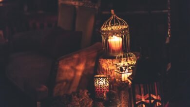 photo of candles inside cages